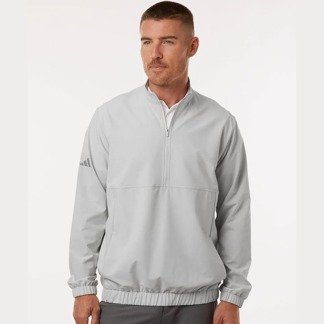 Men's half-zip pullover in a vibrant color with logo detail